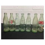 7.5ï¿½ glass coca colla bottles.