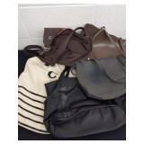 Group of four purses and a bag