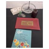 Bank bag, blue book ,dish, napkin rings,glass bowl