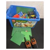 Box of Legos and walkie talkies.