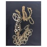 Group of gold in color necklaces