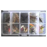 clear plastic fly fishing tackle box containing