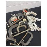 Group of c clamps and blocks and cords