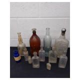 Large group of vintage and antique glass bottles