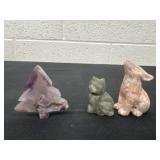 3 carved stone animals and tree