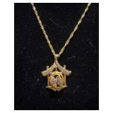 pendant necklace features a cuckoo clock design
