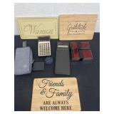 Group of home decor signs and calculators