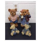 Four collectible bear figurines
