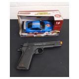 BB gun and collectible Porsche toy car. Car makes