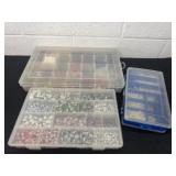 Group of beads in containers