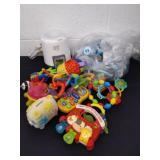 Baby toys, shower favors and a bottle warmer