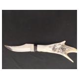 4.75 in knife blade with carved antler handle
