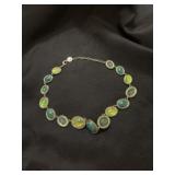 Green rhinestone plus cabochon iridescent