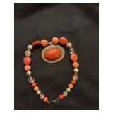 Large chunky orange necklace with pendant