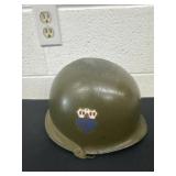 olive-drab steel Army M59/M85 combat helmet,