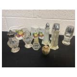 Group of salt and paper shakers glass