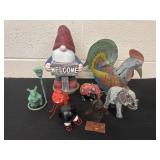 Yard gnome with metal rooster and elephants