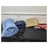 Box of travel gear and shopping bags
