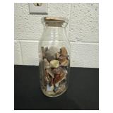Caped milk bottle with polished rocks 7ï¿½