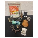 Group of figurines ash tray necklace and books