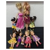 Group of Disney dolls and Barbie dolls