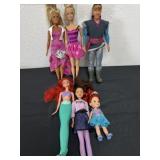 Group of Disney dolls and Barbie