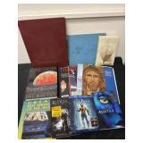 Group of books and DVDs and blue rays and