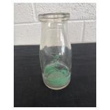 5.5' vintage glass milk bottle featuring green