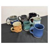 Group of Stone mugs with United States top gun