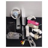 Large group of Wii accessories and a Wii unit