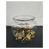 6' glass jar full of brass fittings