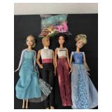 Group of Barbie and Disney dolls with accessories