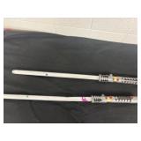 Two toy lightsabers