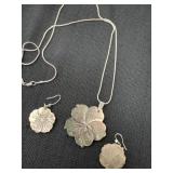 iridescent, carved abalone shell flower pendant