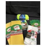 Large group of car cleaning sponges and towels