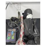 Knee pads and a cover with some cords and misc