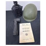 Military helmet with Manuel and canteen and