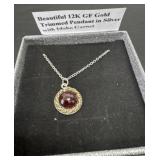 Beautiful 12k gf gold trimmed pendant in silver
