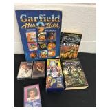 Garfield comic and halo books and Reba tapes
