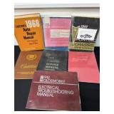 Group of auto repair books