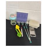 Group of kitchen items and Starbucks tins and