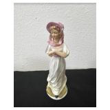 8ï¿½ vintage porcelain figurine appears to depict