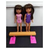 two 14.5 inch dolls with a Barbie balance beam