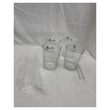 Four brand new glasses with straws