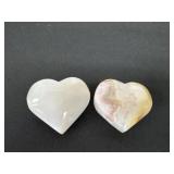 shows two polished natural agate heart carvings