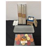 Candle sticks and tea light candles with candle