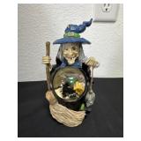 8ï¿½ Halloween witch figurine holding a broom and a