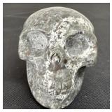 2ï¿½ hand-carved human skull sculpture made from a