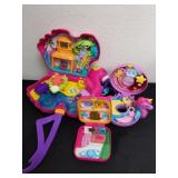 Three Polly pockets