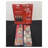 4 new sealed coca coca table weights and pencils